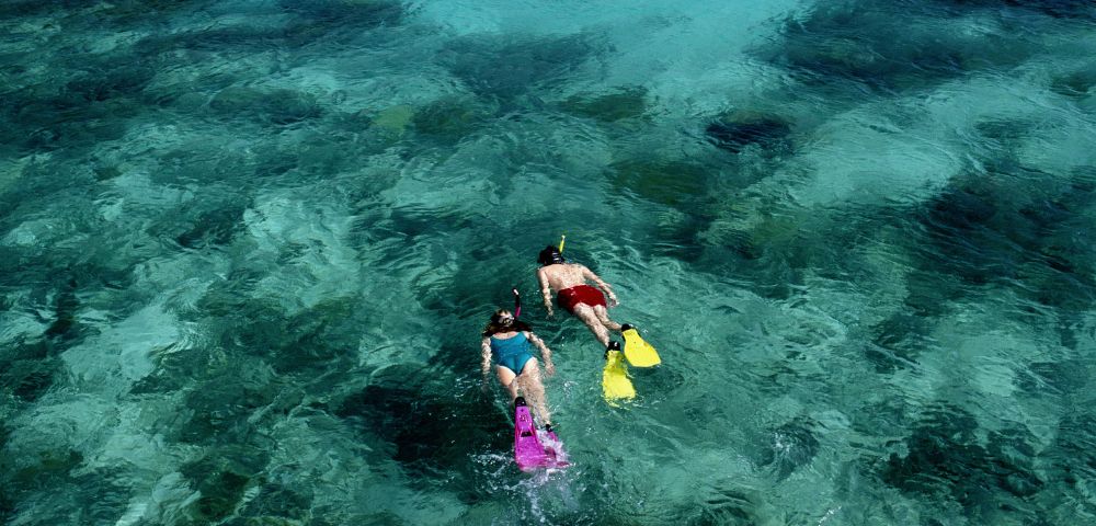 my-fiji-10032457-two-people-snorkelling-the-bay-of-islands-reef-at-vanua-levu