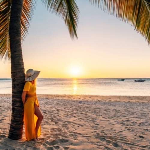 lady-in-yellow-dress-at-the-beach-for-sunset-in-fiji