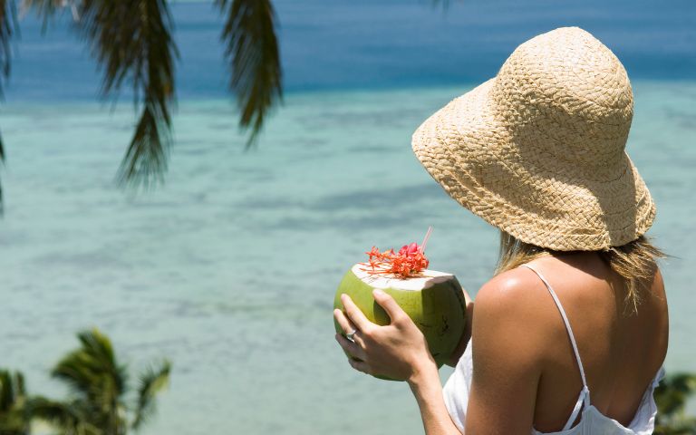 my-fiji-woman-drinking-from-coconut-beach