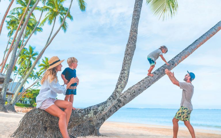 my-fiji-family-playing-on-palm-tree-at-resort-in-fiji