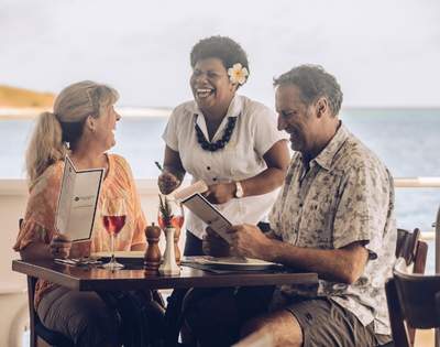 my-fiji-couple-laughing-with-staff-on-blue-lagoon-cruises-ship