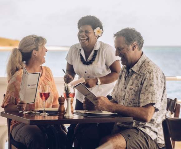 my-fiji-couple-laughing-with-staff-on-blue-lagoon-cruises-ship