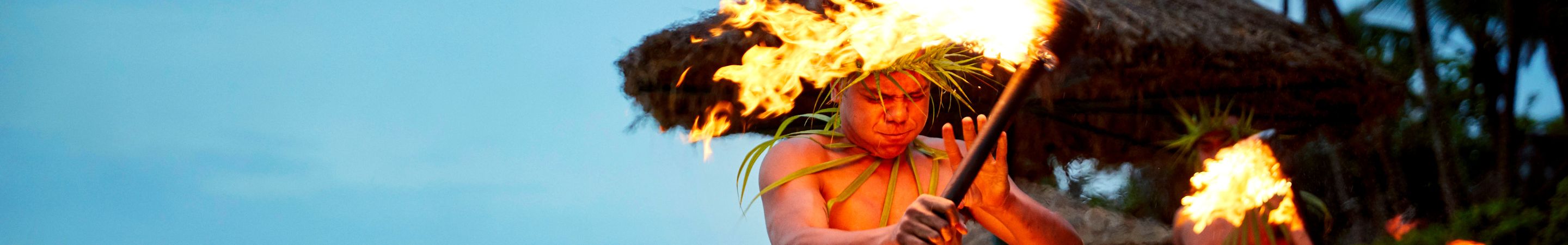 my-fiji-D4_7_Outrigger-Fiji-Beach-Resort_1407_BlueSky1-fijian-local-twirling-fire