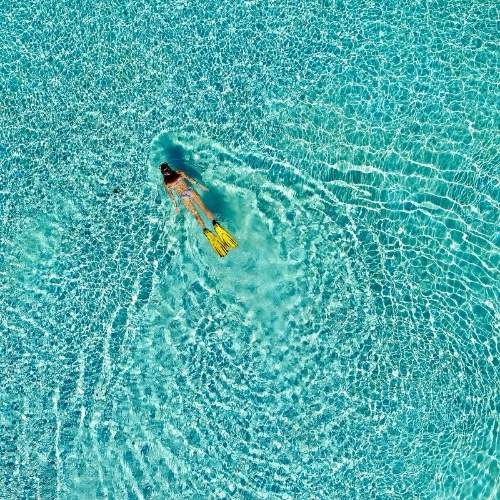 woman-snorkelling-at-fiji-marriott-resort-momi-bay