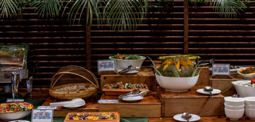 buffet spread of food with fruits and salads