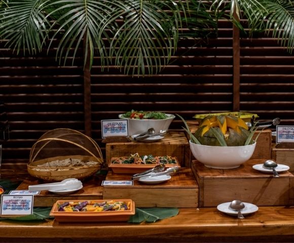 buffet spread of food with fruits and salads