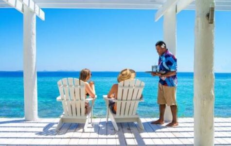 my-fiji-two-people-being-served-drinks-in-a-private-cabana-at-malamala-beach-club