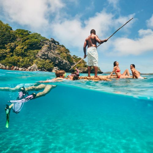 my-fiji-mamanuca-islands-fijian-man-spear-fishing-with-family-in-fiji