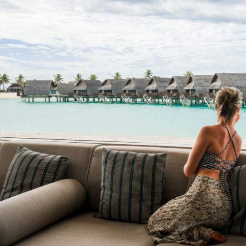 my-fiji-momi-bay-woman-sitting-on-ocean-villa-in-fiji