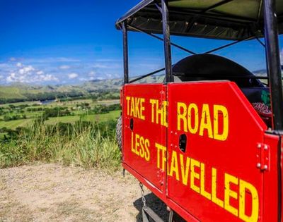 my-fiji-offroad-cave-safari-atv-safari-with-painted-sign-that-reads-take-the-road-less-travelled