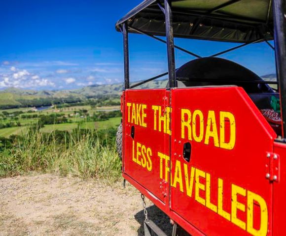 my-fiji-offroad-cave-safari-atv-safari-with-painted-sign-that-reads-take-the-road-less-travelled