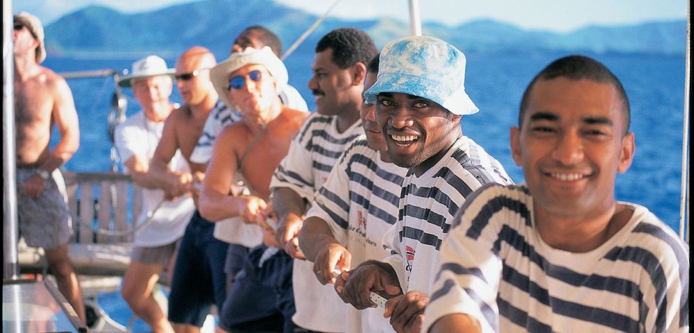 MYFIJI-Robinson-Crusoe-Island-Tours-Tivua-Island-People-sailing-and-smilling