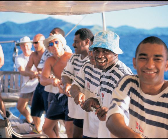 MYFIJI-Robinson-Crusoe-Island-Tours-Tivua-Island-People-sailing-and-smilling