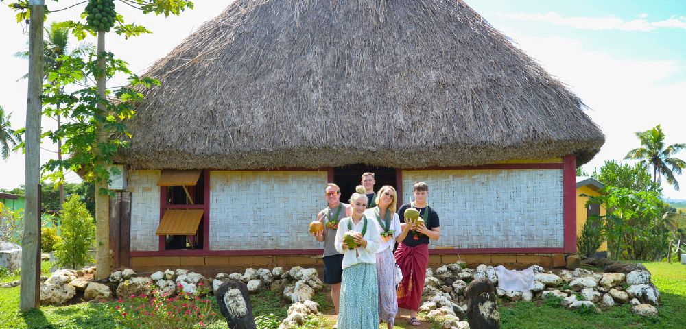 MY-FIJI-Robinson-Crusoe-Tours-Village-and-Mud-Catching-Tour-Family-in-front-of-fare