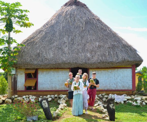 MY-FIJI-Robinson-Crusoe-Tours-Village-and-Mud-Catching-Tour-Family-in-front-of-fare