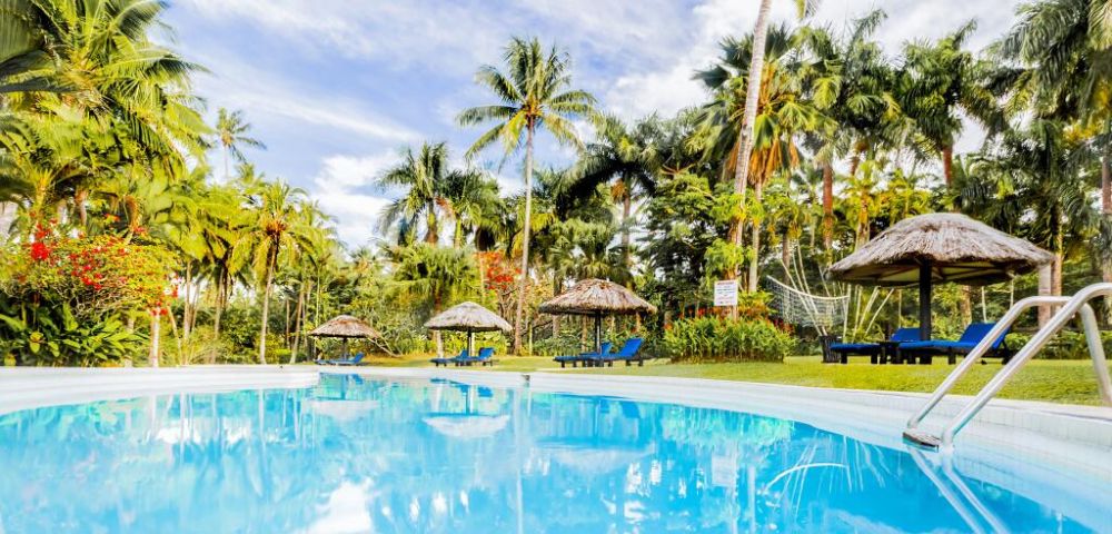 MY-HOLIDAY-Pool-and-lounge-chairs-by-day-at-Tambua-Sands-Beach-Resort