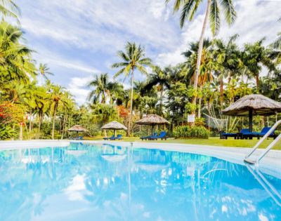 MY-HOLIDAY-Pool-and-lounge-chairs-by-day-at-Tambua-Sands-Beach-Resort