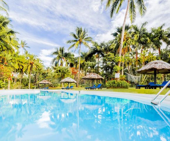 MY-HOLIDAY-Pool-and-lounge-chairs-by-day-at-Tambua-Sands-Beach-Resort