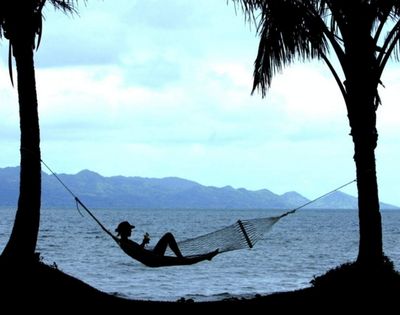 my-fiji-person-relaxing-in-hammock-on-the-beach-at-the-pearl-resort-spa-and-golf-course-in-beqa-lagoon