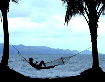 my-fiji-woman-relaxing-in-a-hammock-by-the-water-at-the-pearl-resort-spa-golf-course