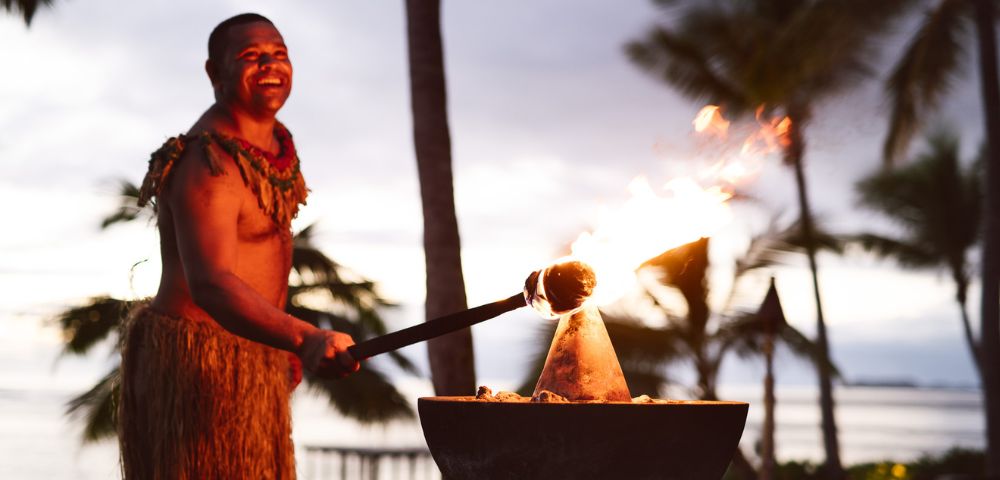 my-fiji-fijian-lighting-torch-in-fire-at-Tokoriki-Island-Resort