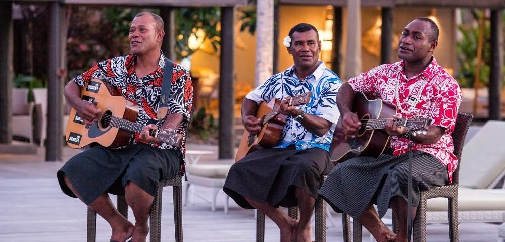 my-fiji-three-locals-singing-and-playing-guitar-at-vomo-island-fiji