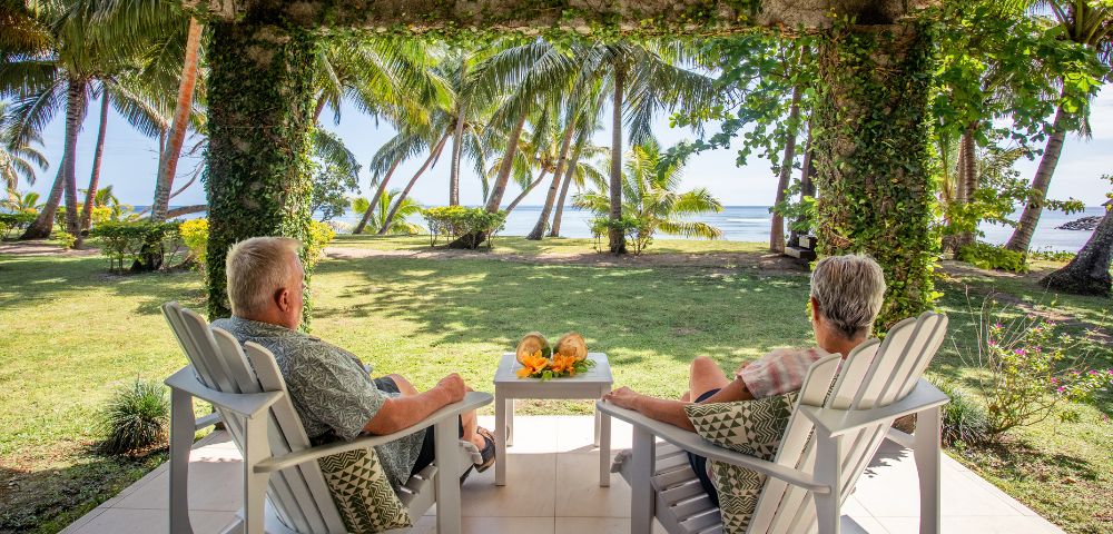 my-fiji-old-couple-sitting-in-hut-covered-with-plants-at-waya-island-resort