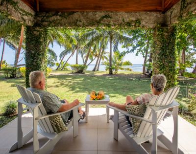 my-fiji-old-couple-sitting-in-hut-covered-with-plants-at-waya-island-resort