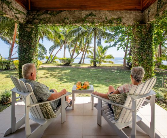 my-fiji-old-couple-sitting-in-hut-covered-with-plants-at-waya-island-resort