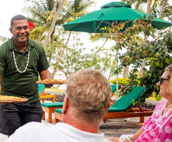 my-fiji-pizza-being-served-poolside-by-fijian-man-to-couple-at-waya-island-resort