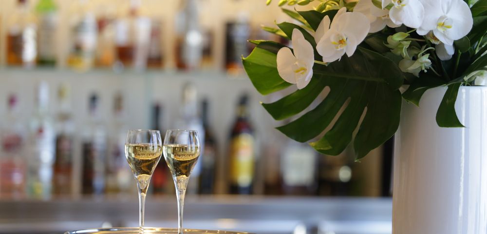 AIRPORT-View-of-two-glasses-of-champagne-the-Aspire-Lounge-in-Sydney