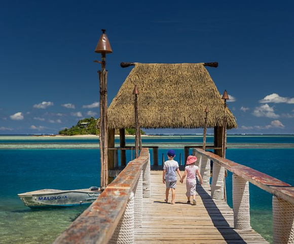 my-fiji-two-kids-walking-down-the-jetty-at-at-malolo-island-resort