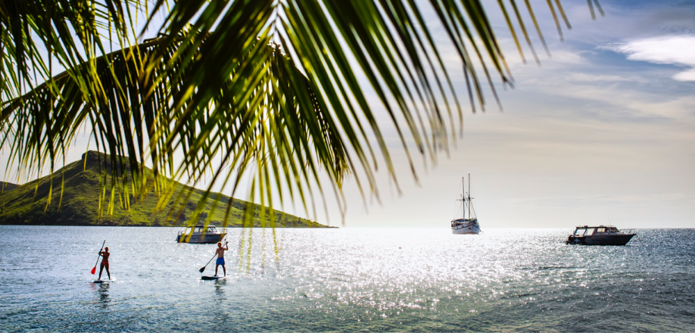 my-fiji-two-poeple-stand-up-paddleboarding-at-volivoli-beach-club